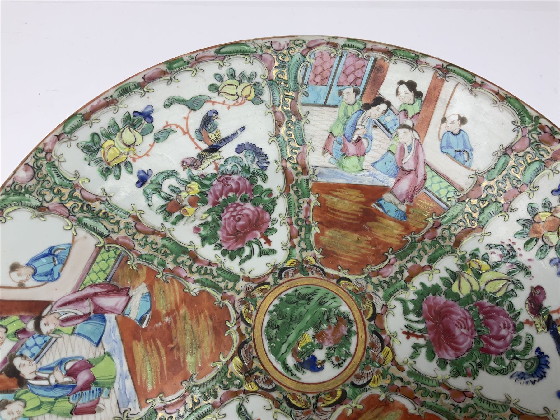 Late 19th century Cantonese enamel charger, decorated with panels of figures and panels of flowers amongst blossoming foliage, D36cm