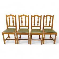 Beaverman - set of four oak dining chairs, shaped cresting rail over two shaped vertical r...