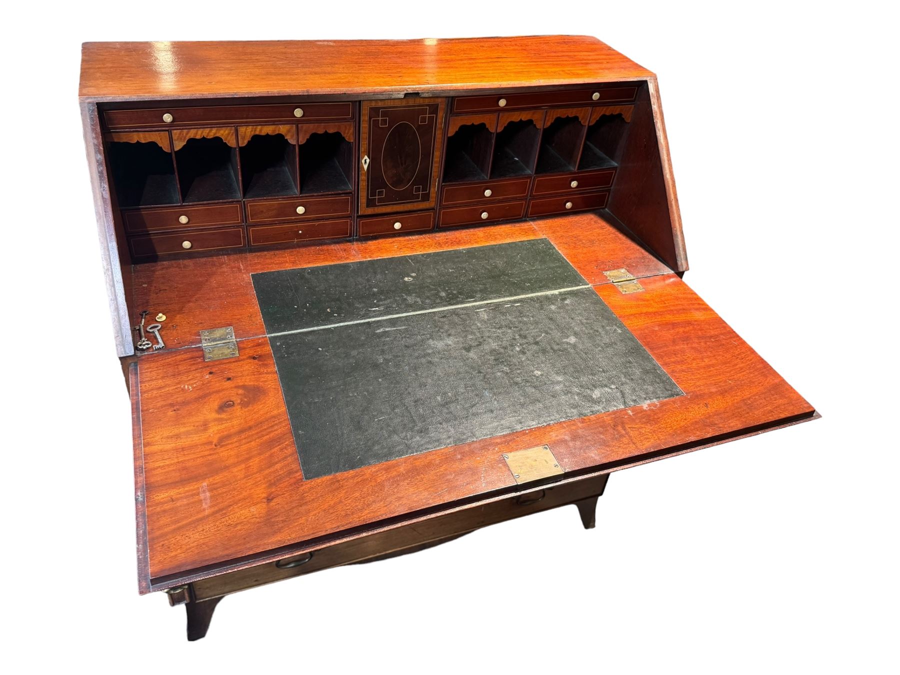 Georgian mahogany bureau, moulded fall front enclosing cupboard, small drawers, pigeonholes and inset writing surface, fitted with four long graduating cock-beaded drawers, on splayed bracket feet 