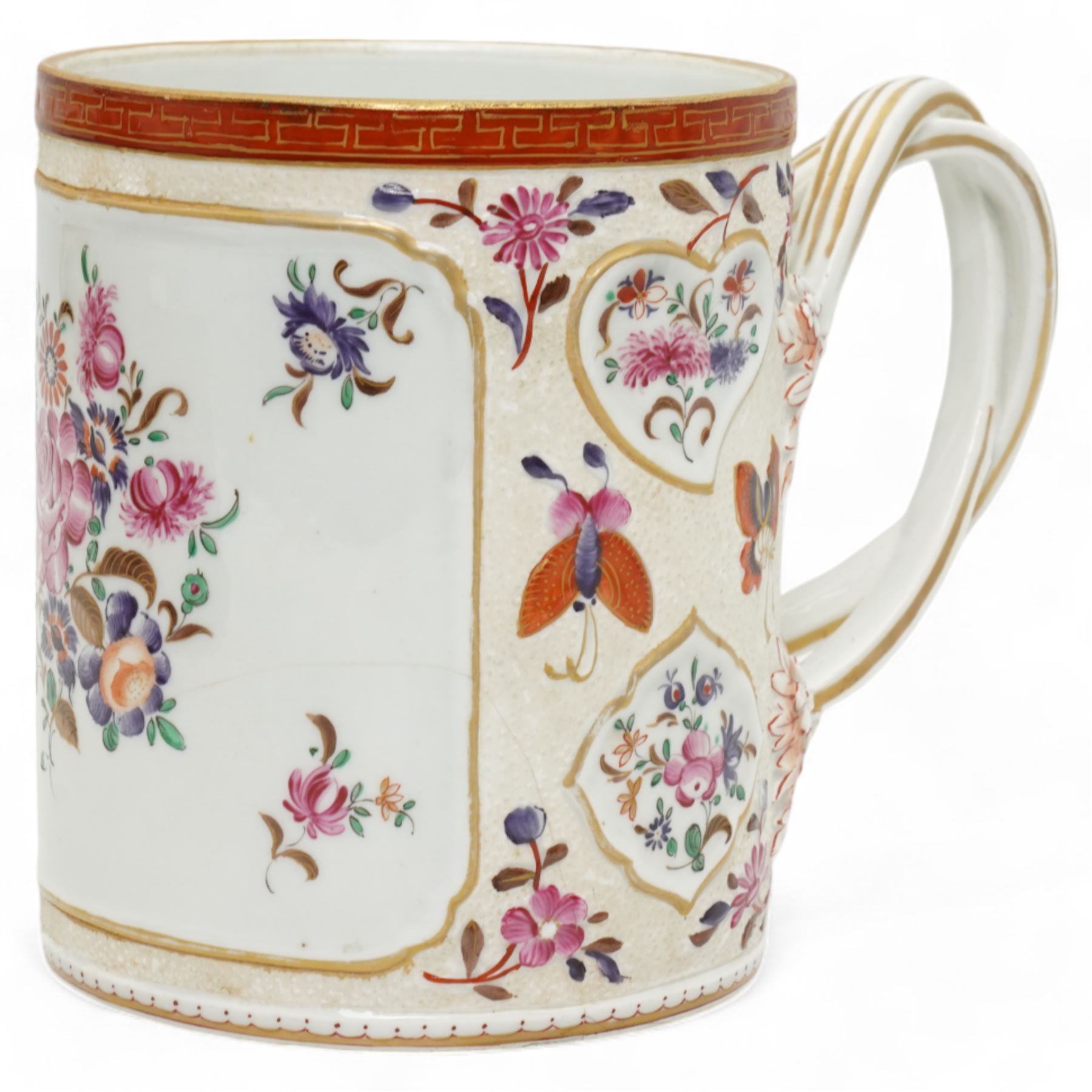 Large porcelain tankard by Samson of Paris, decorated in the Chinese Export famille rose style with panels of flowers, against a low relief ground of butterflies and floral sprigs, with reeded strapwork handle, H15cm