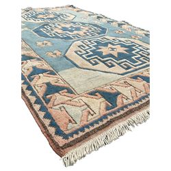 Turkish pale blue ground rug, overall geometric design, the field decorated with three medallions within geometric patterned border