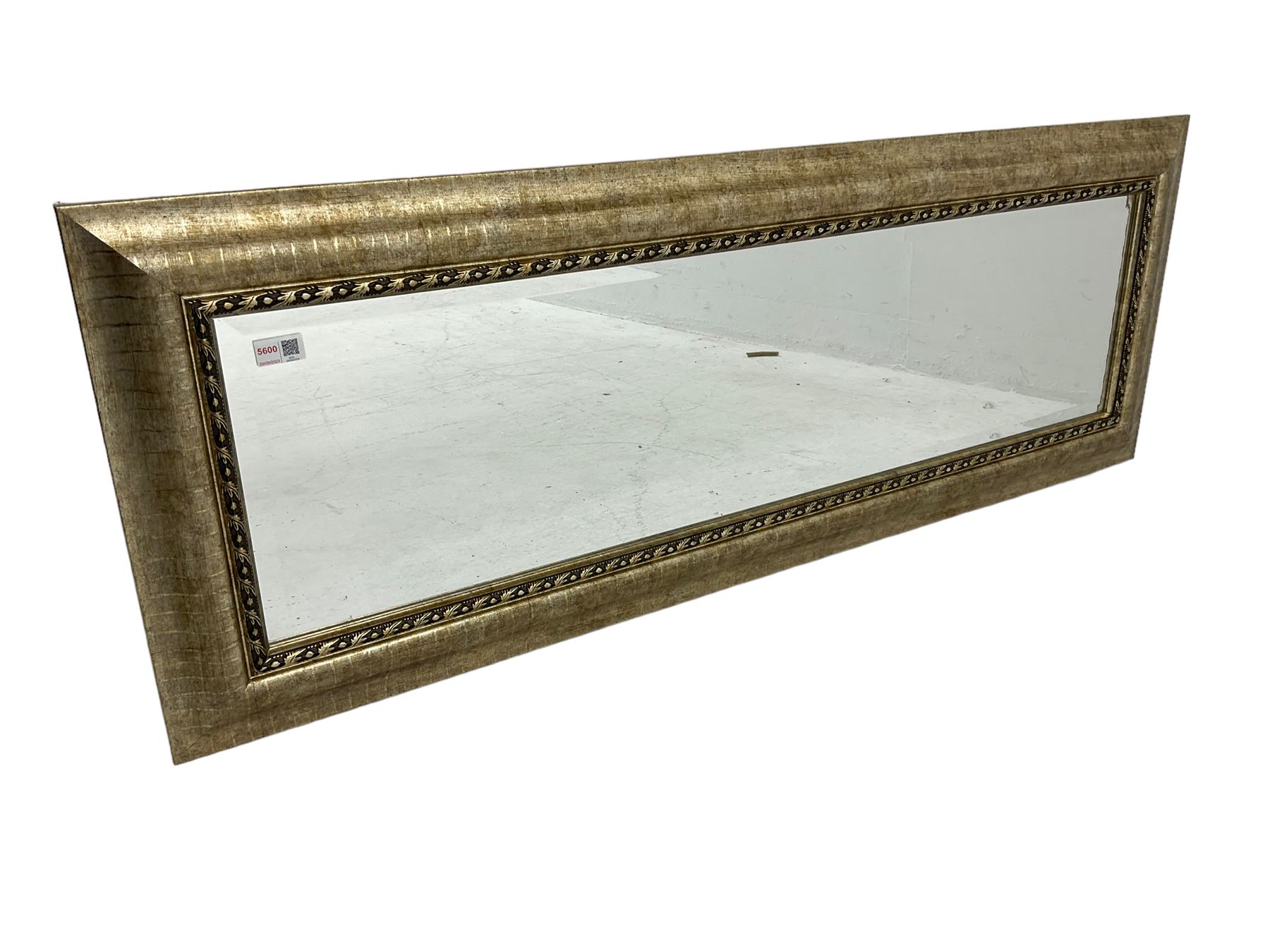 Rectangular wall mirror in gilt famed, bevelled glass plate