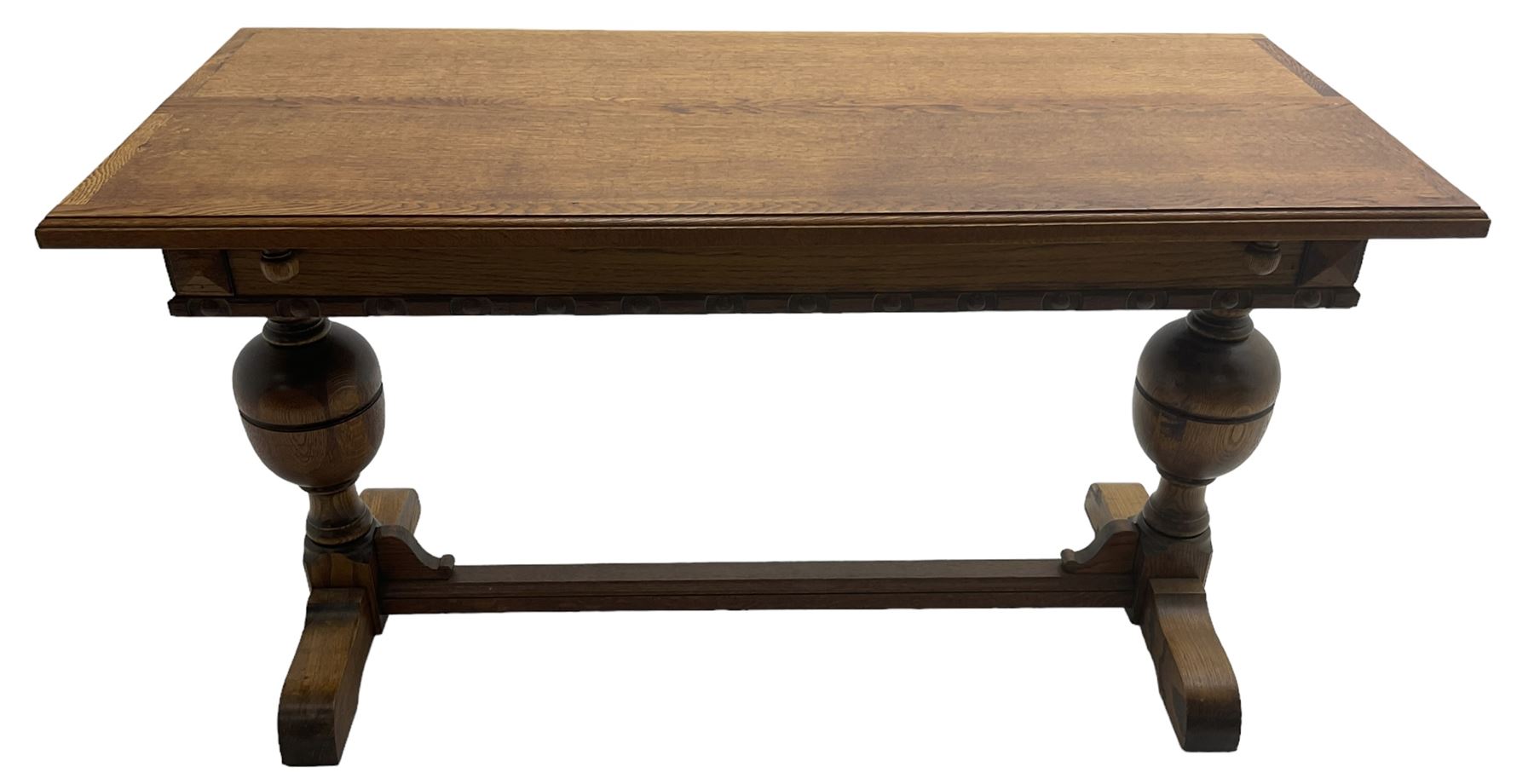 Early 20th century oak 'Ee-zi-Way one motion extending dining table', rectangular top over twin baluster end supports united by stretcher