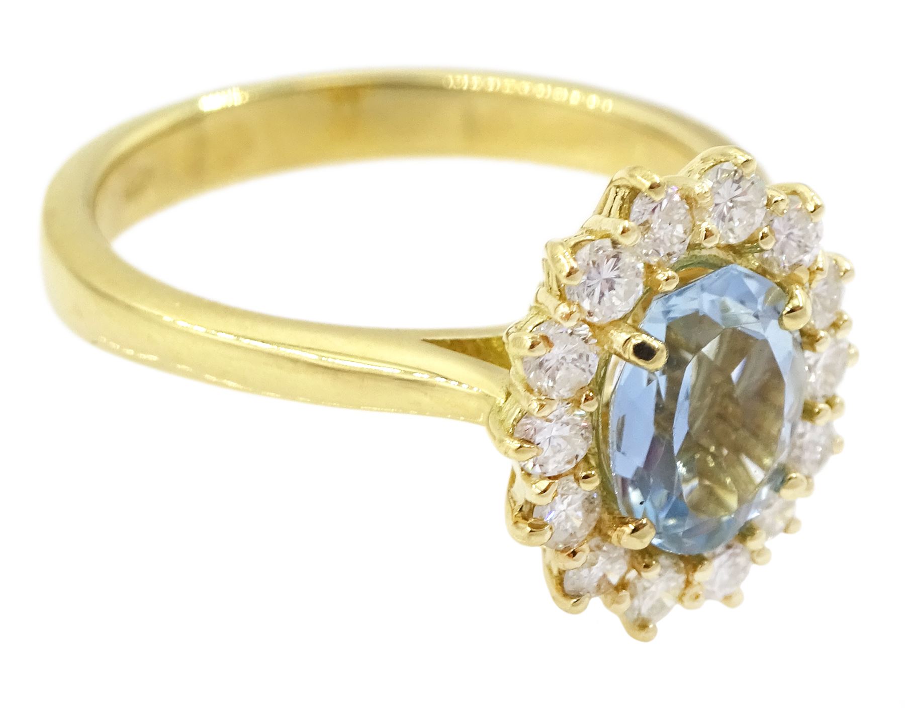 18ct gold oval cut aquamarine and round brilliant cut diamond cluster ring, hallmarked, aquamarine approx 0.85 carat, total diamond weight approx 0.40 carat