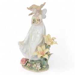 Lladro figure, Mystical Garden, modelled as a fairy with flowers in arms, no 6686, with or...