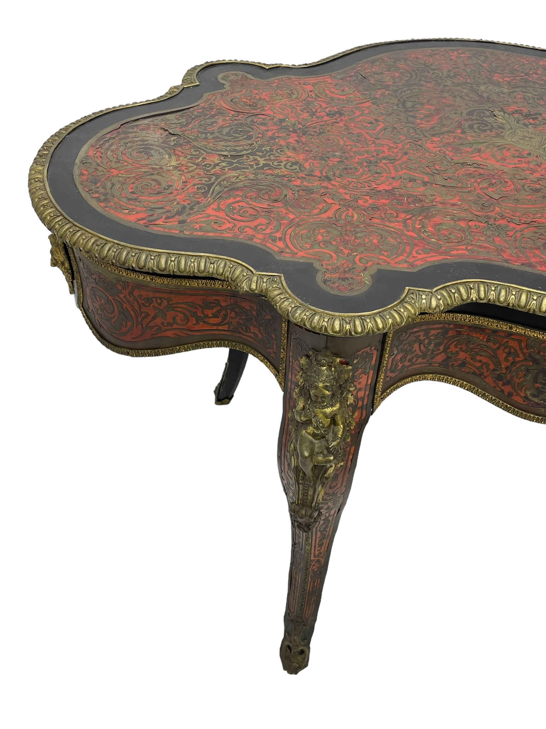 Victorian Louis XV design boulle work centre table, shaped form, decorated extensively with brass and red tortoise shell scroll work, central extending acanthus leaves surrounded by scrolling foliage, gardroon and floral cast brass edge, the frieze rails decorated with further boulle work and green man gilt metal cast masks, the cabriole supports mounted by seated putti mounts on S-scroll brackets surrounded by oak leaves and acorns, ornate scroll and floral cast terminal caps