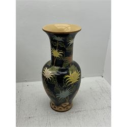 Floor vase with stylised flowers on a black ground, H84cm