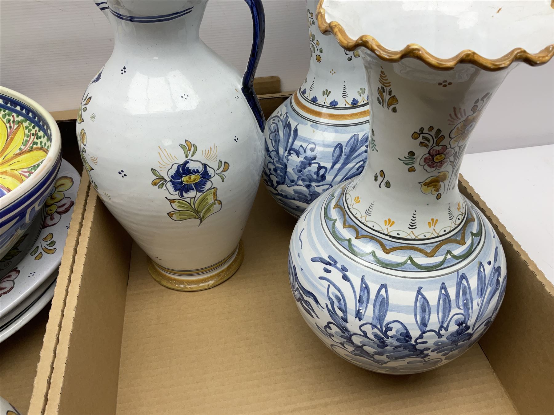 Collection of continental ceramics including jugs, chargers and vases 