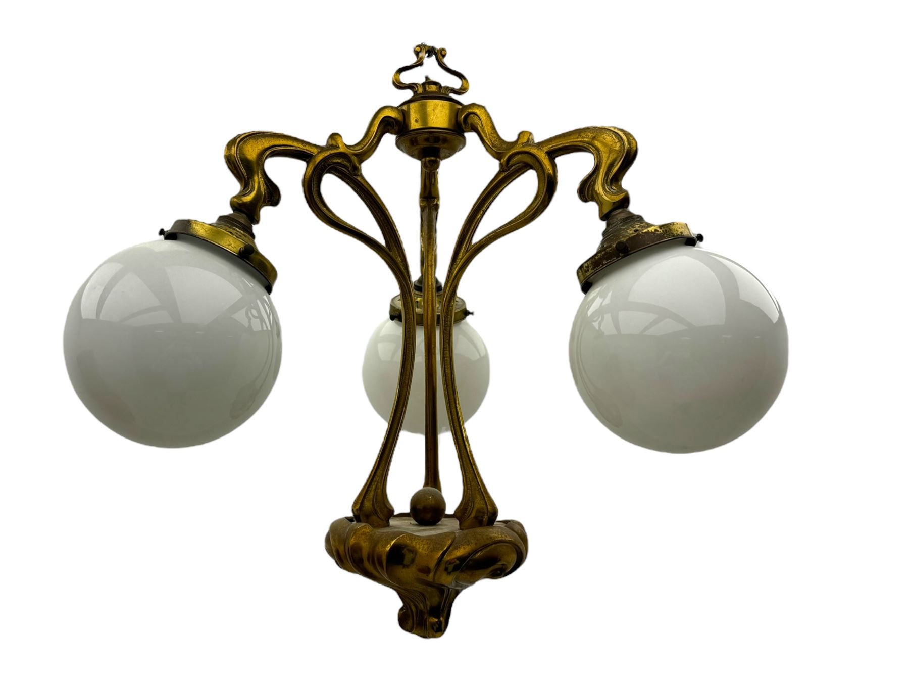 Pair of Art Nouveau design gilt metal ceiling lights, each with three stems connecting glass dome