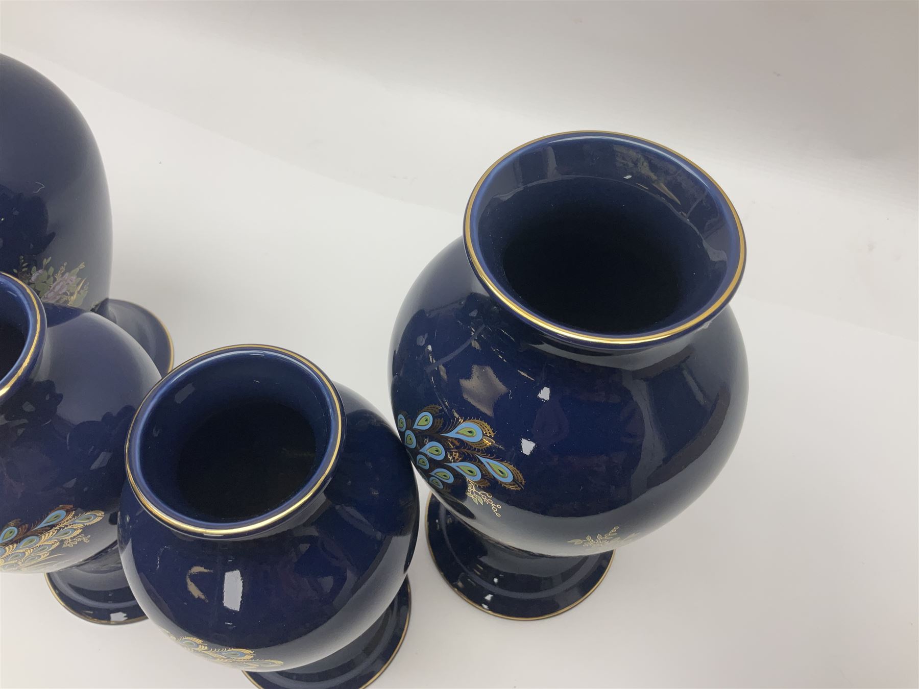 Two pairs of Royal Winton vases, decorated with peacocks on a blue ground, largest H24cm