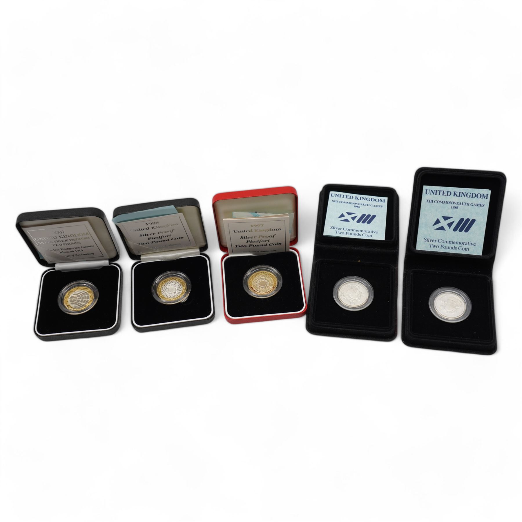 Five The Royal Mint United Kingdom silver proof two pound coins, comprising two 1986 'XIII Commonwealth Games', 1997 piedfort, 1998 piedfort and 2001 'Wireless Bridges the Atlantic Marconi 1901' piedfort, all cased with certificates