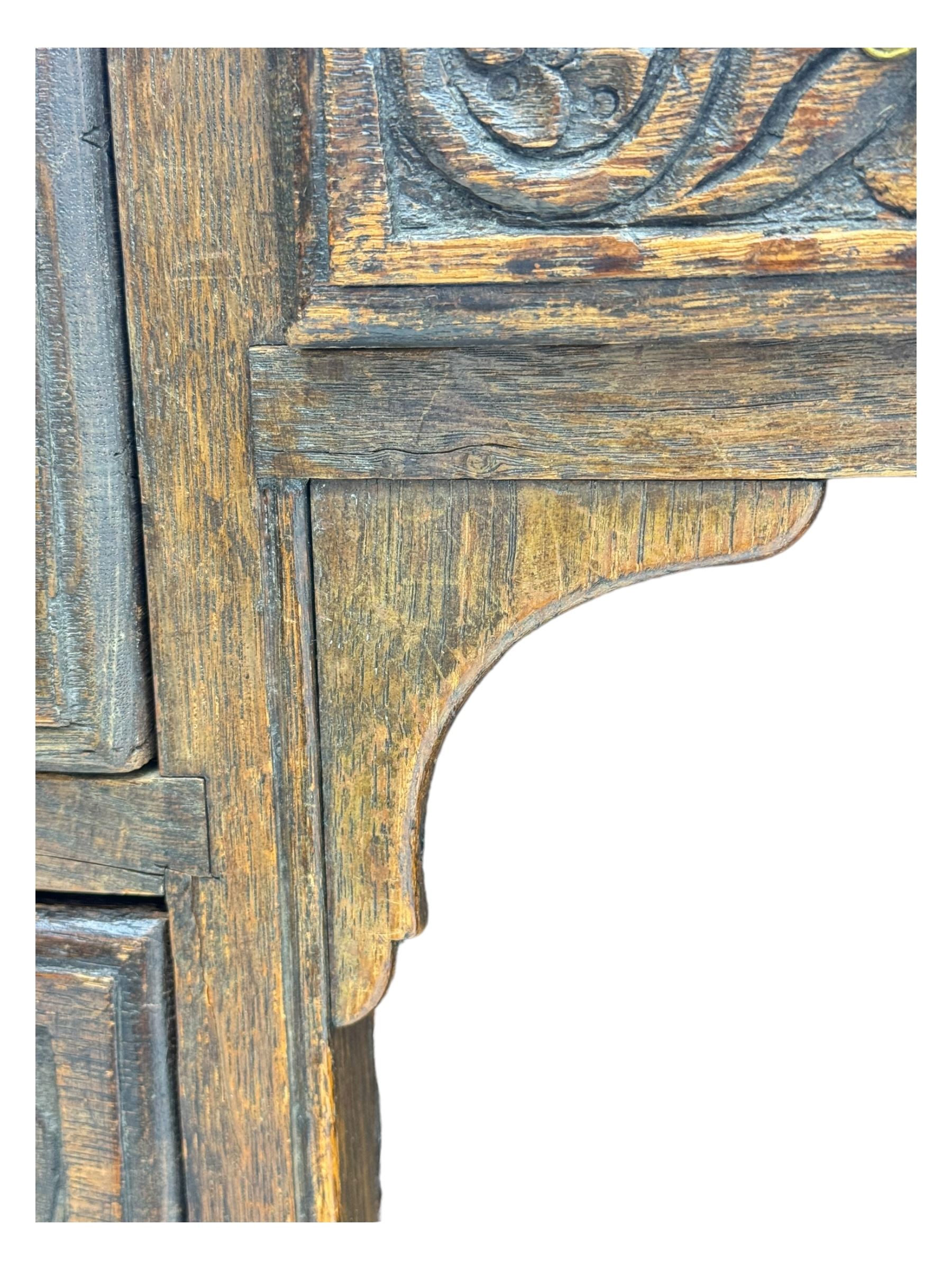 Victorian carved oak kneehole desk, the rectangular top with carved edge, above central drawer with carved front and brass handles, central kneehole with cupboard door, flanked by two banks of three graduating drawers each with similarly carved decoration, on shaped plinth base with castors