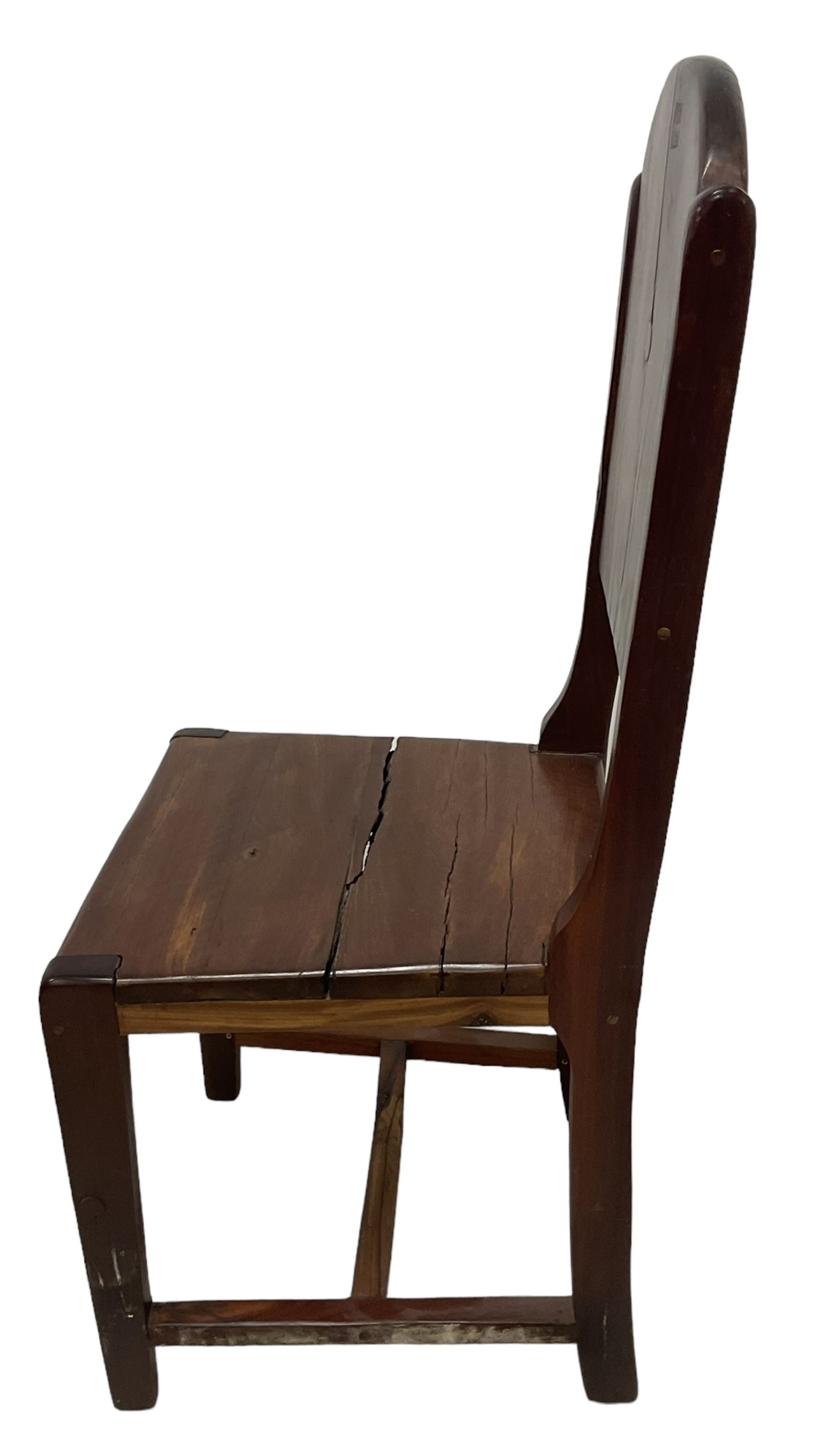 Mid-to-late 20th century teak dining table, rectangular top with canted corners, on square tapering supports with spade feet (214cm x 119cm, H76cm); and a set of eight Burmese reclaimed teak dining chairs, high arched back over panelled seat