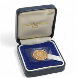 Queen Elizabeth II 2002 gold full sovereign coin, housed in a blue case