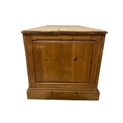 20th century waxed pine kneehole desk, rectangular top over nine drawers with cup handles, on moulded plinth base