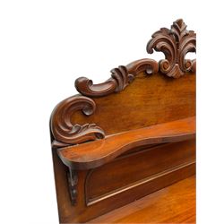 Victorian mahogany chiffonier, raised back with carved C-scroll foliage mounts and shelf, rectangular top with rounded corners over frieze drawer and double panelled cupboard, on skirted base