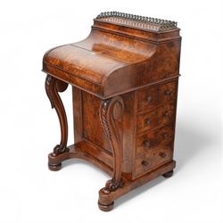 Victorian figured walnut piano top Davenport, the moulded top with brass gallery opens to reveal hidden compartment fitted with divisions, the piano lid enclosing slide with hinged leather writing surface, pen holder and two drawers, the right-hand side fitted with four drawers and the opposing side with four false drawers, on acanthus carved cabriole supports with scrolled terminals, sledge platform on turned feet 