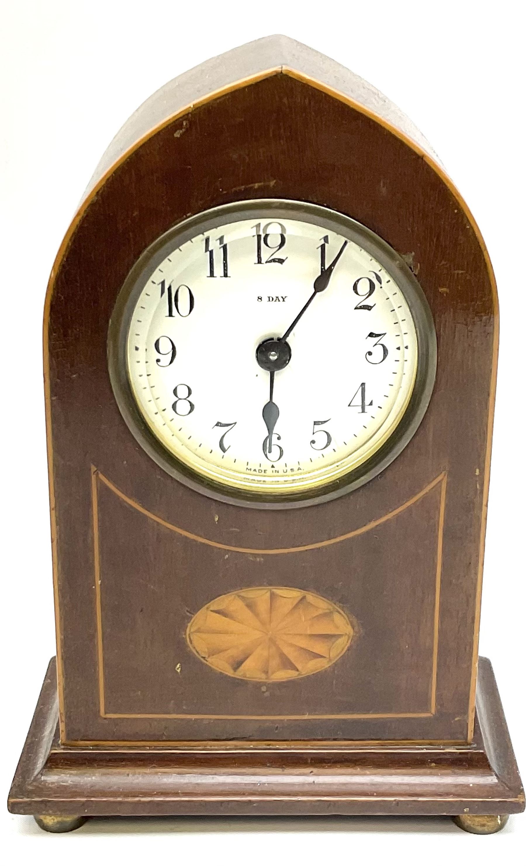 Edwardian mahogany and boxwood strung mantel lancet clock, the dial with black Roman numerals, marked 8 Day Made in U.S.A, upon four compressed bun type feet, H18.5cm