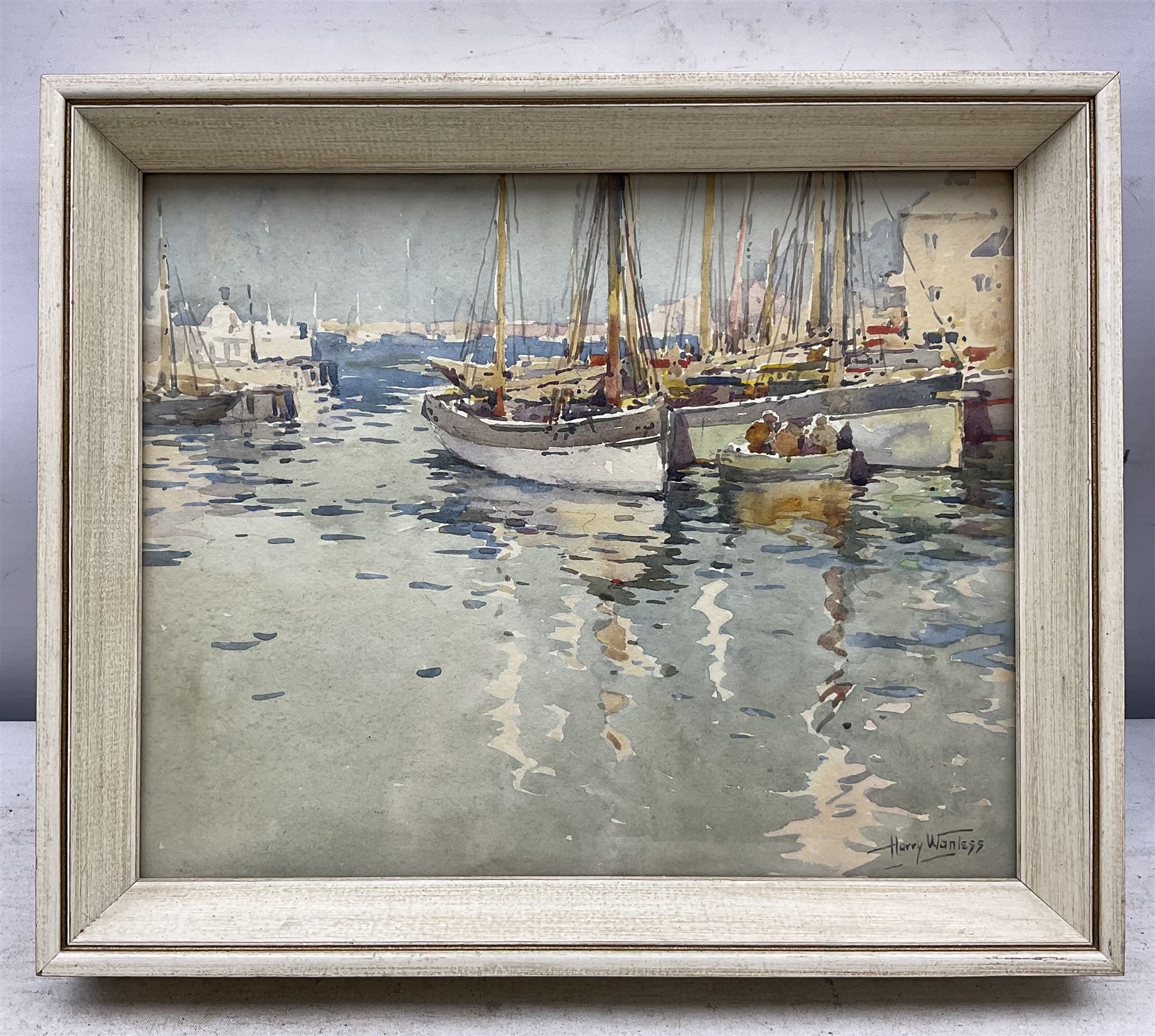 Harry Wanless (British c1872-1934): Fishing Boats by the Quayside (probably Brixham), watercolour signed 20cm x 25cm 
Provenance: direct from the artist's family, part of a collection never previously seen on the market