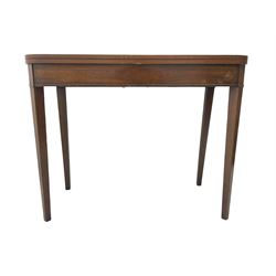 Early 20th century mahogany tea table, fold-over swivel top with rounded corners, raised on square tapering supports