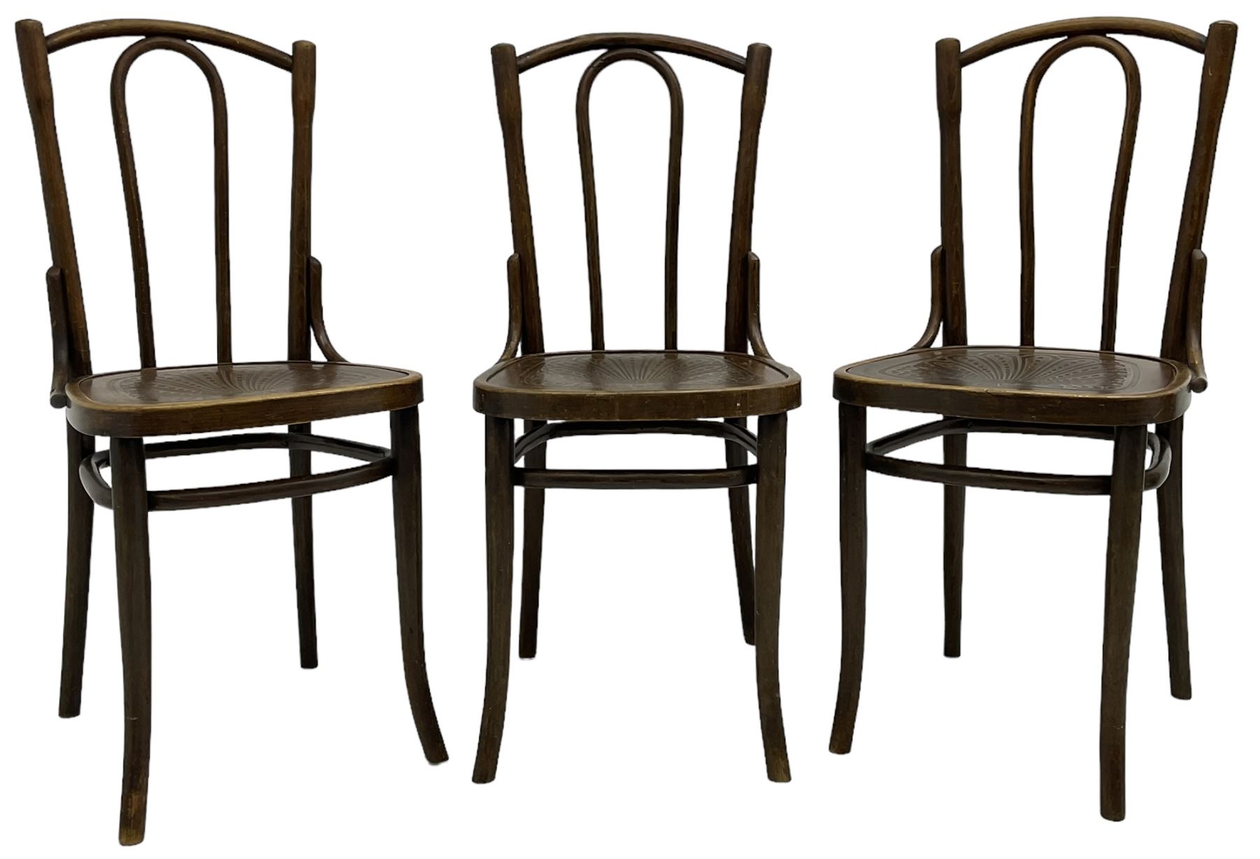 Set of three late 19th to early 20th century century bentwood dining chairs, the seats with pressed anthemion decoration, circa. 1900s