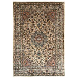 Persian Kashmar camel ground carpet, palmette rosette medallion on a field of curling leaf...