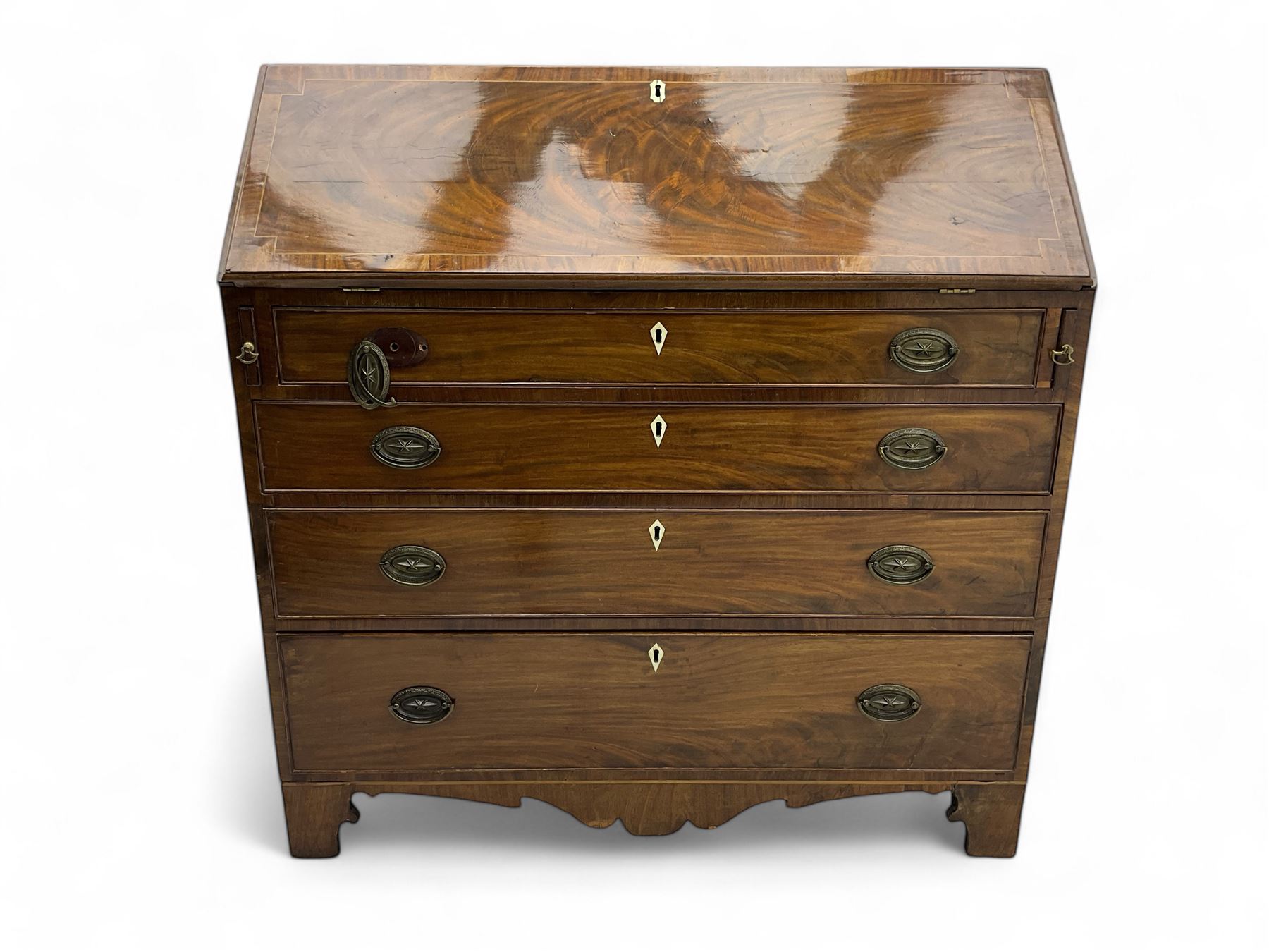 George III mahogany bureau, hinged fall front enclosing satinwood interior fitted with cupboard, drawers and pigeon holes, four long graduating cock-beaded drawers, bone escutcheons, shaped apron on bracket feet 