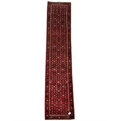 North West Persian Malayer runner, red ground field decorated with Herati motifs, guarded border decorated with trailing flowerhead band 