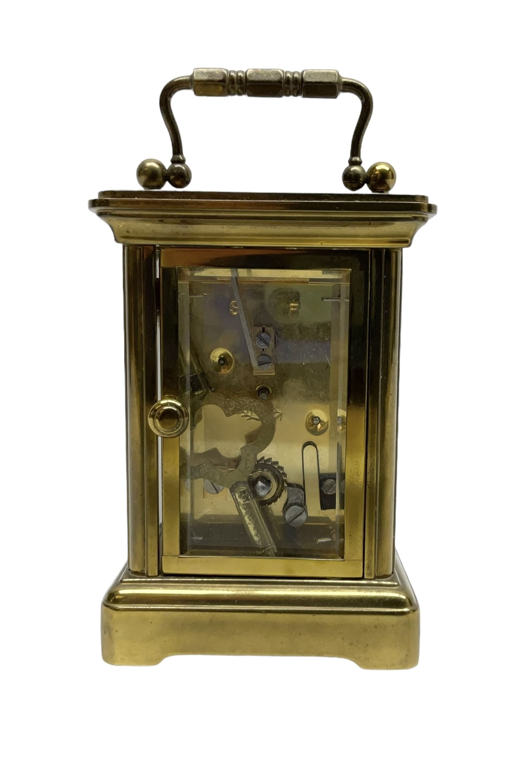 Matthew Norman - miniature 20th century brass carriage clock, 8-day timepiece movement in a corniche case with an enamel dial, Roman numerals and moon steel hands, with a jewelled lever platform escapement. With key.