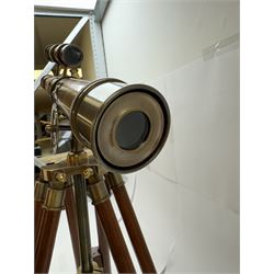 Brass telescope upon a wooden adjustable tripod, H55cm 