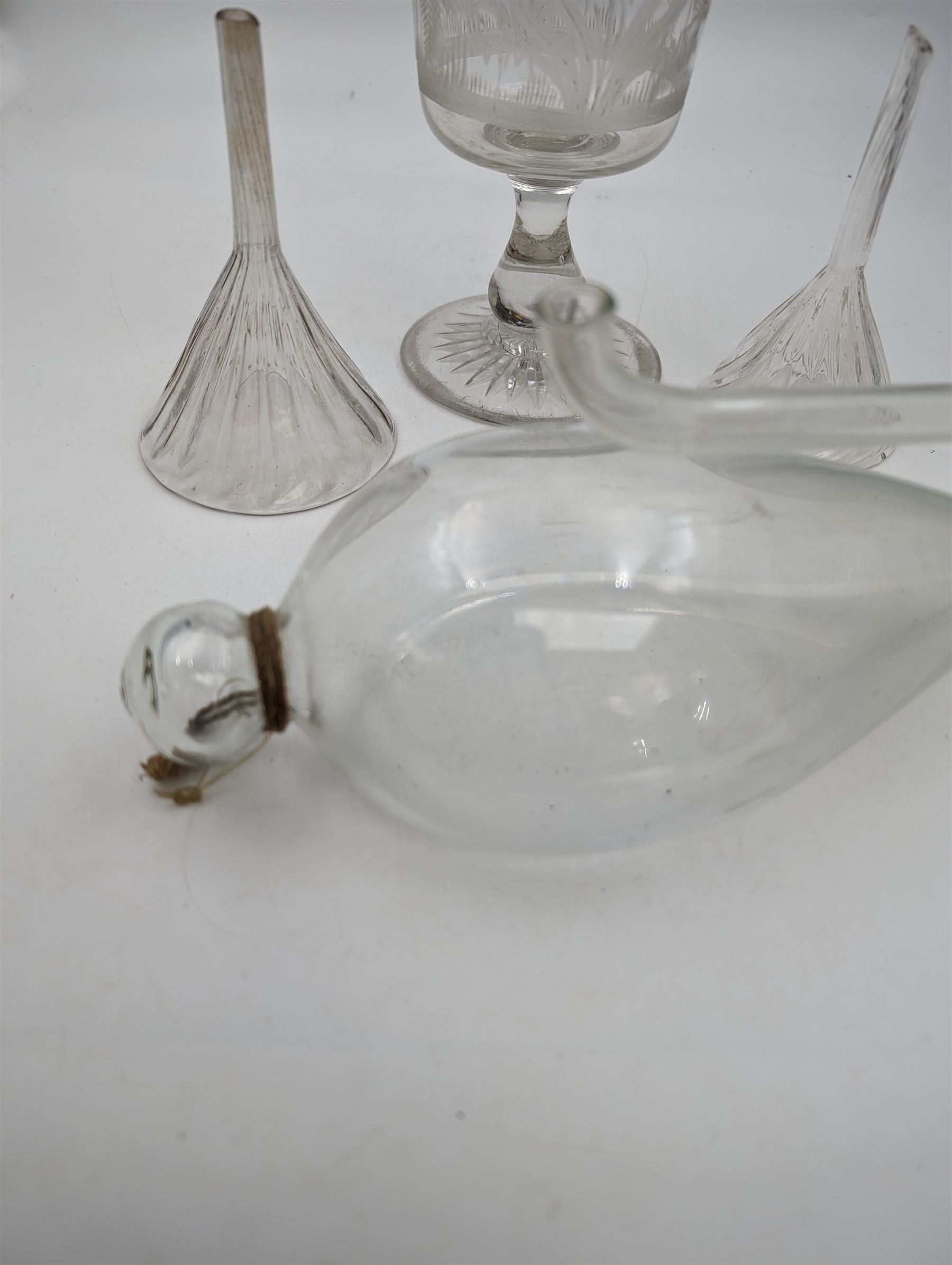 Collection of glassware, comprising etched glass celery vase, water barometer, and two wine funnels 