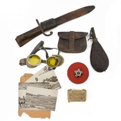 Collection of military items, including pilot googles, ammunition pouch, leather powder flask etc 