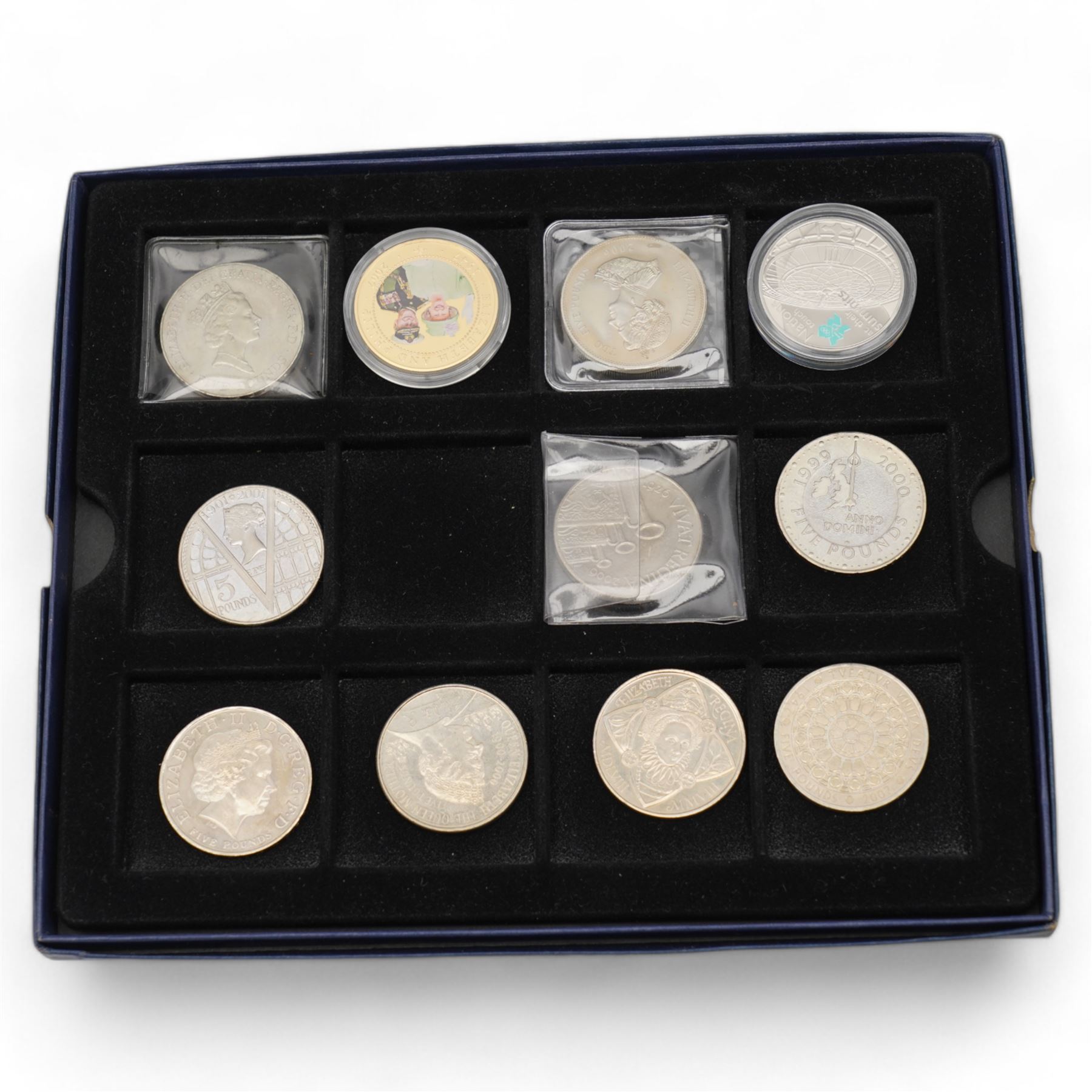 Mostly commemorative coinage, including various Queen Elizabeth five pound coins with two brilliant uncirculated 1999 in card folders, United Kingdom 1983 proof coin collection cased with certificate, commemorative crowns etc