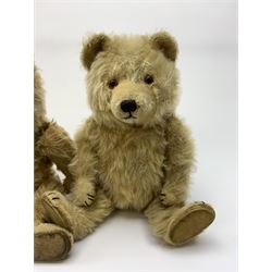 Chiltern Ting-a-Ling teddy bear c1950s with blond mohair body, swivel jointed head with glass eyes and vertically stitched nose and mouth, jointed limbs with velvet pads and card lined feet and internal chimes H14