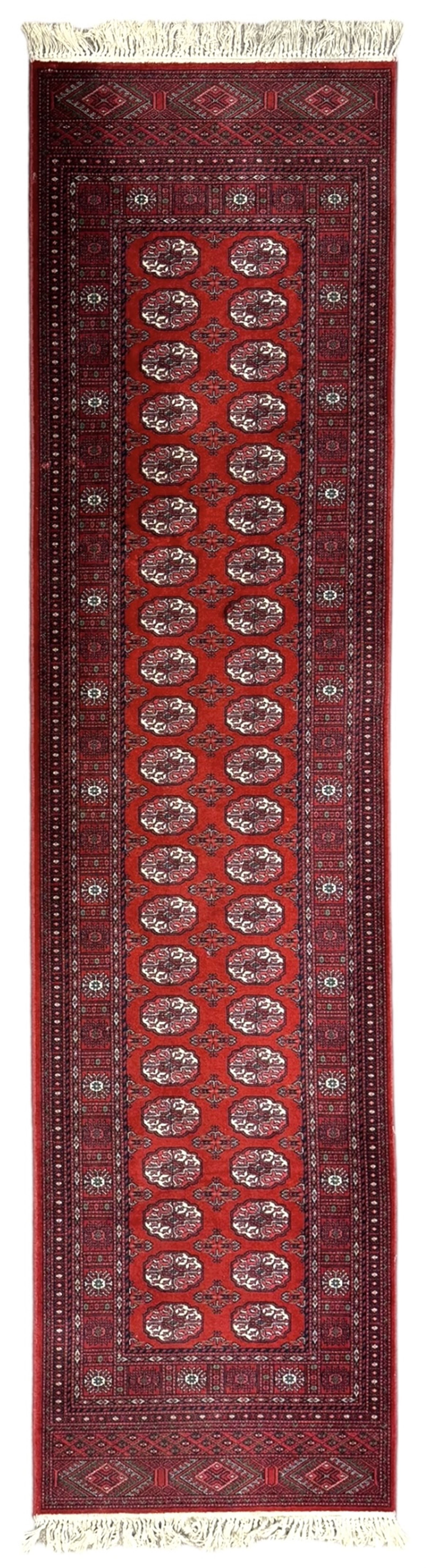 Persian Bokhara crimson ground runner rug, the field with a series of repeating ivory octagonal medallions, main border with repeating flower head pattern and diamonds within multiple guard stripes