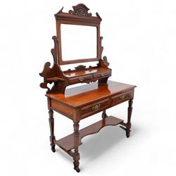 Late Victorian walnut dressing table, raised swing mirror back over two trinket drawers with brass Art Nouveau handle plates, rectangular top fitted with two further drawers, raised on square ring-turned supports united by shaped under-tier, on castors