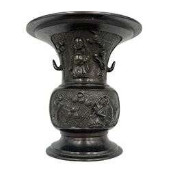 Chinese bronze gu vase decorated with a raised pattern of flowering branches, figures hold...