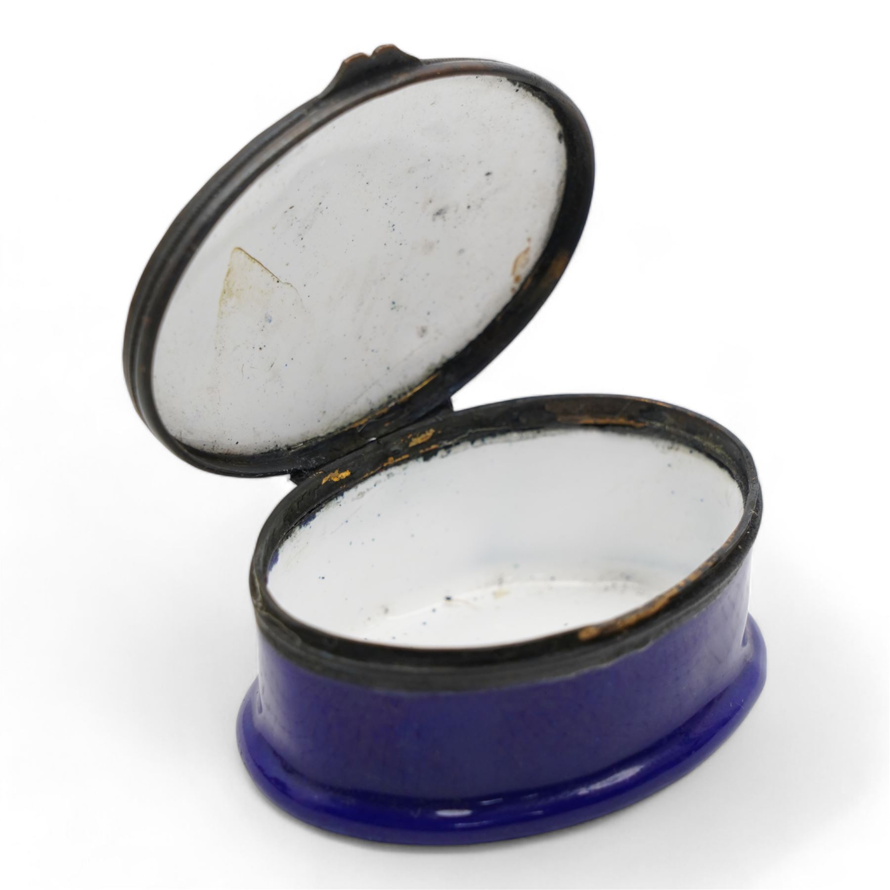 George III South Staffordshire enamel oval patch box, the slightly domed hinged cover painted with an oval portrait of a young girl and dove and inscribed 'The Gift of a Friend', within gilt and white beaded borders, raised upon a blue base, L5cm x H2.5cm 