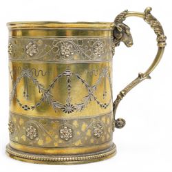 Victorian silver gilt christening mug of Gothic design engraved with trailing garlands with raised beaded flower heads and rams head handle H9cm London 1868 Maker Henry Holland in leather case