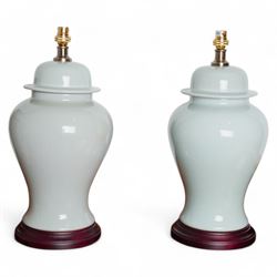 Pair of Chinese porcelain lamps in the form of vases and covers, each decorated with a pal...