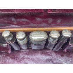 Early 20th century leather bound travelling case, with initials to cover, with fitted interior containing five silver topped glass jars, each engraved with initials, hallmarked The Alexander Clark Manufacturing Co, London 1910 & 1911, case W61cm