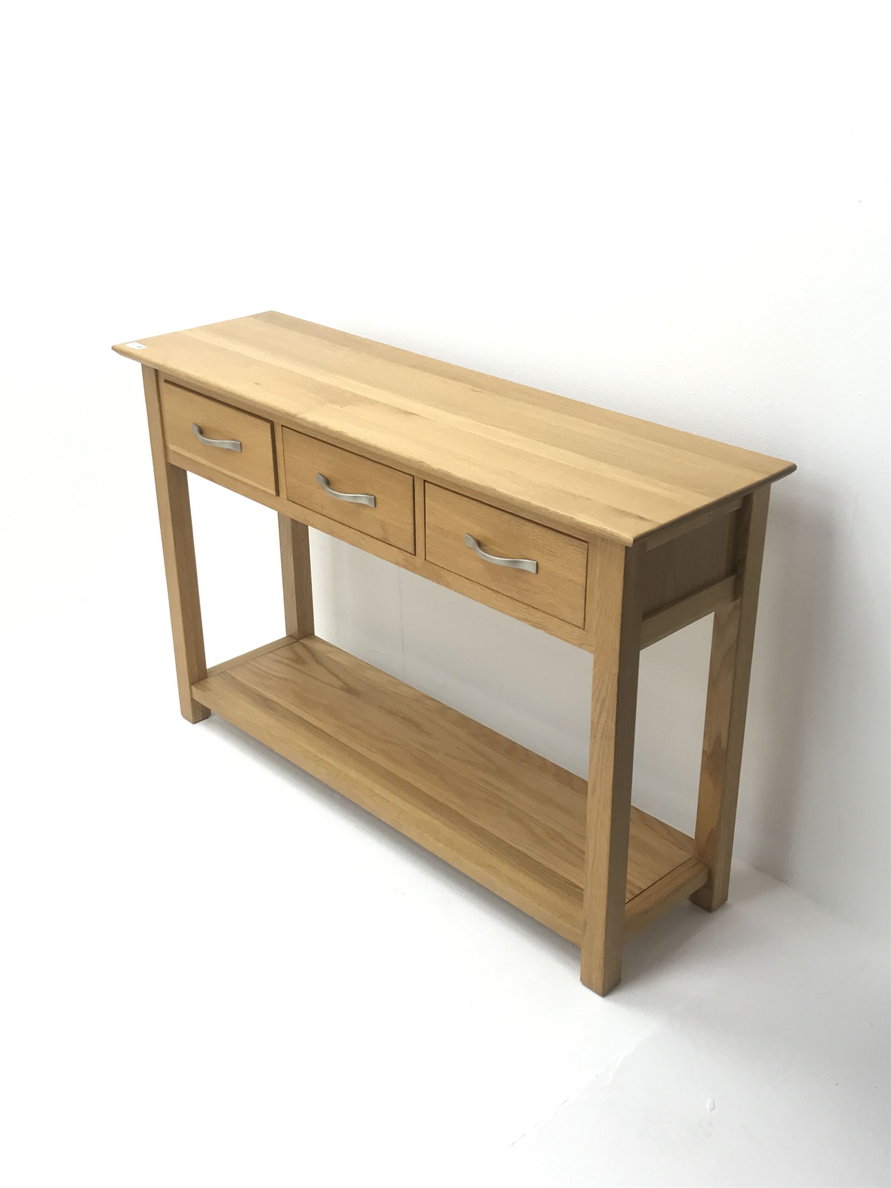 Light oak side console table, three drawers, square supports joined by solid undertier