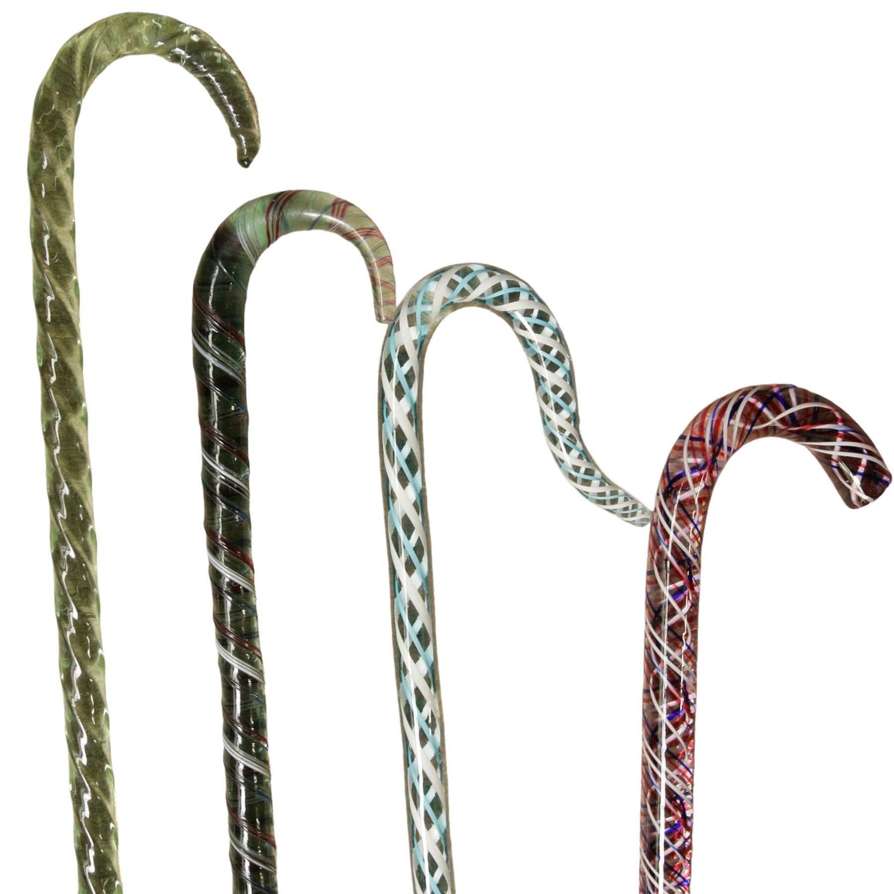 Seven glass walking canes, including a Victorian  double helix example, two in the form of shepherds crooks with barley twist stems, three others with spiral twist decoration and one other, max L177cm 