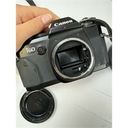 Canon T60 camera body serial no 25230455 together with a collection of Canon camera accessories, including zoom lenses, bellows, etc 