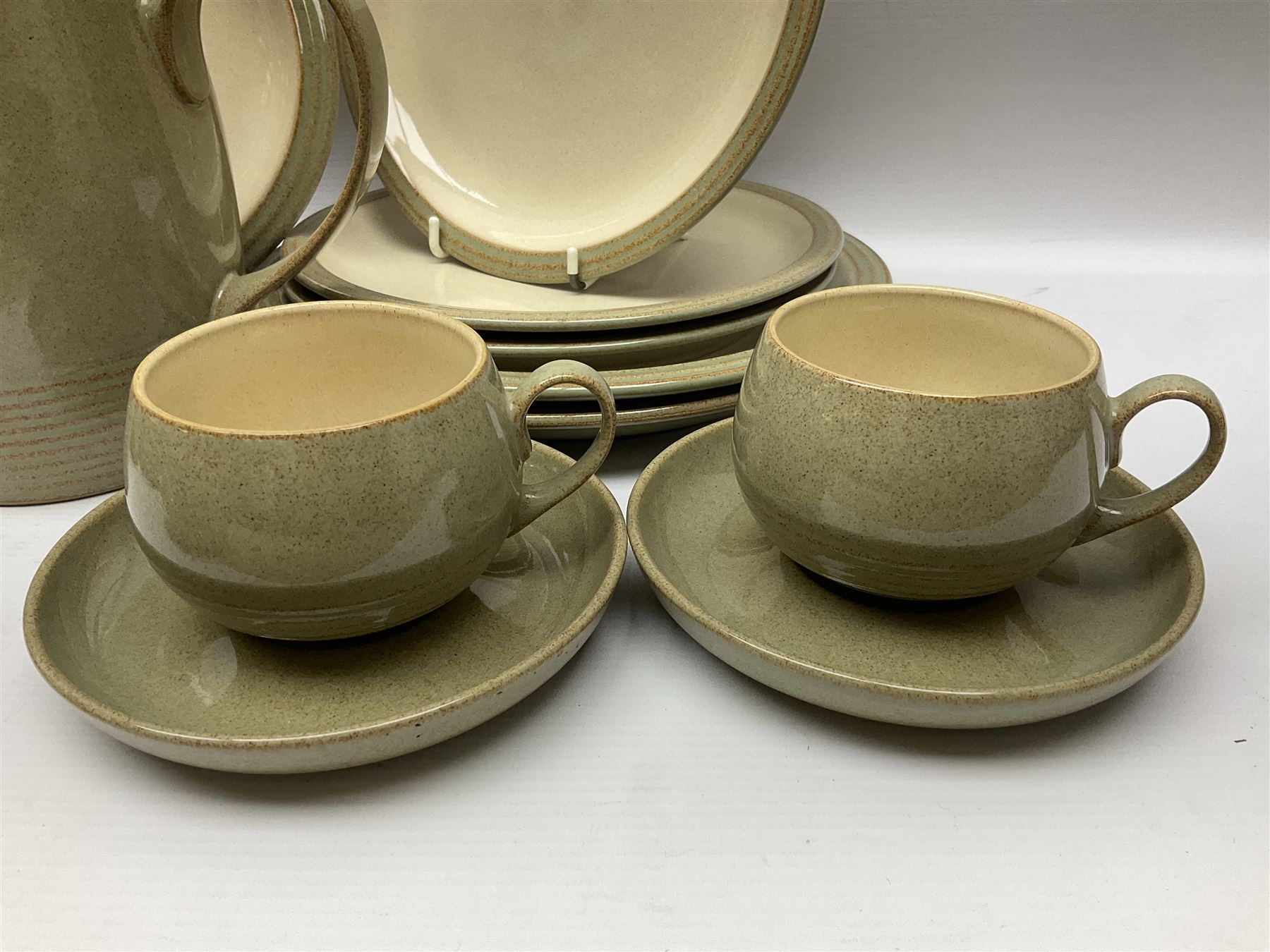 Denby tea and dinner wares, including bowls, jugs, tureens, side plates, dinner plates, serving dishes, cups and saucers, coffee pot, etc, all decorated with a green and brown mottled glaze, with printed marks beneath, in two boxes 