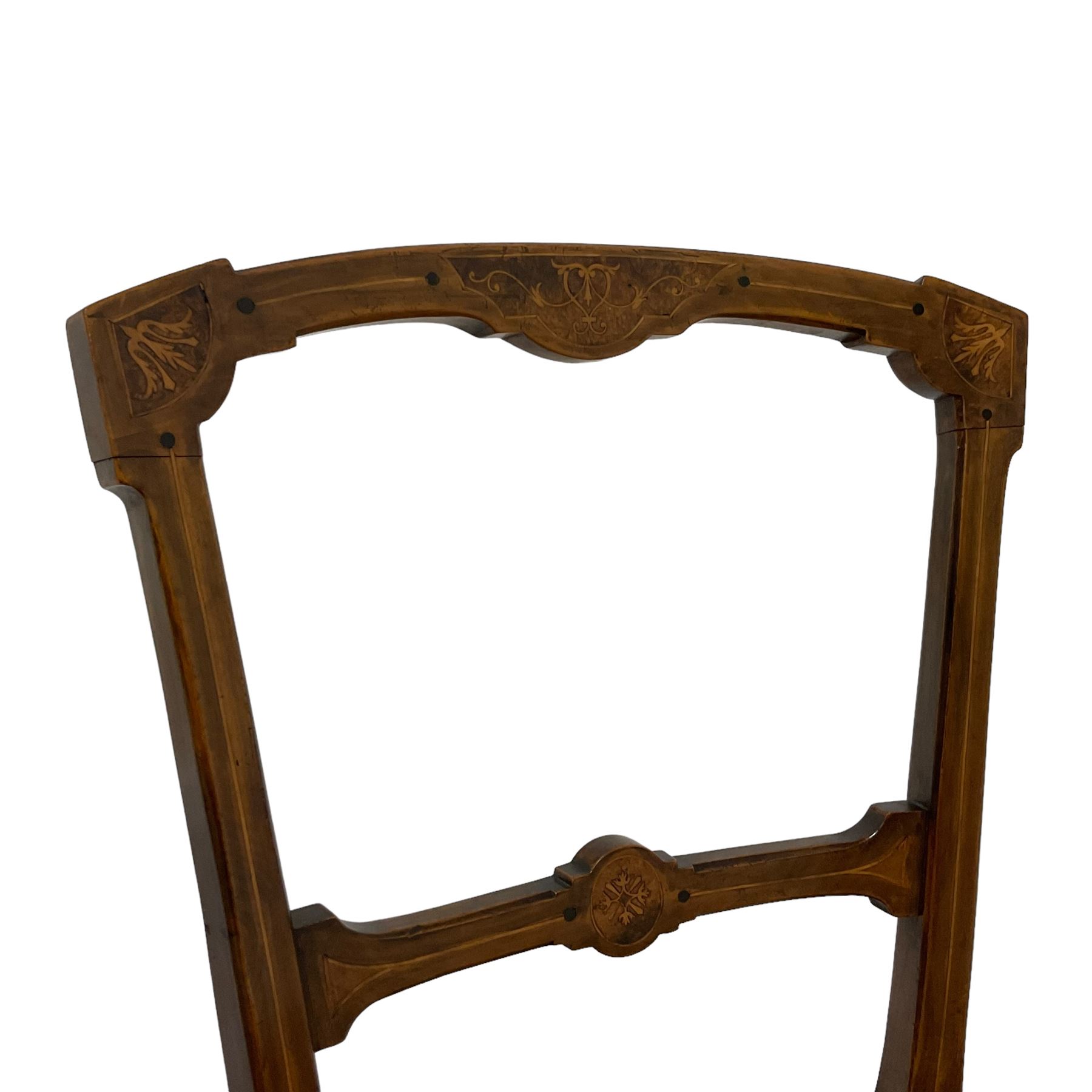 Set of five Victorian Aesthetic Movement inlaid walnut dining chairs, cresting rail and centre bar decorated with scrolling foliate inlays, raised on turned tapering supports with satinwood stringing