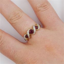 9ct gold three stone ruby and diamond crossover ring, hallmarked