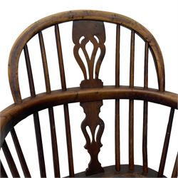 19th century yew wood and elm Windsor armchair, low double hoop stick and pierced splat back, dished seat on turned supports united by crinoline stretchers