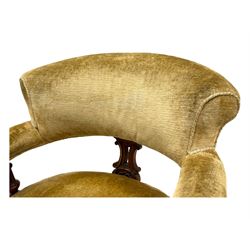 Victorian pair of mahogany armchairs, upholstered in gold velvet fabric, each with curved back, pierced splat and scroll arms, one with rounded seat and the other square, on turned front supports with castors