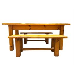 Pine dining table, rectangular plank top on square supports (181cm x 91cm, H80cm); together with two benches (133cmx 41cm, H47cm)